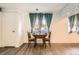 Cozy dining area with a small table, seating for two, and natural light from the window at 1165 S Fairplay Cir # B, Aurora, CO 80012