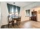 Comfortable dining area features a vintage cabinet with nearby windows providing ample light at 1165 S Fairplay Cir # B, Aurora, CO 80012