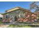 Inviting home featuring a mix of siding and brick, complemented by a well-kept lawn, on a sunny day at 1165 S Fairplay Cir # B, Aurora, CO 80012