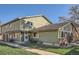 Charming townhome with a well-maintained lawn and a sidewalk leading to the front door on a sunny day at 1165 S Fairplay Cir # B, Aurora, CO 80012