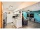 Efficient kitchen featuring stainless steel appliances, white cabinets, and a convenient layout for meal preparation at 1165 S Fairplay Cir # B, Aurora, CO 80012