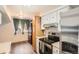 Bright kitchen features modern appliances, white cabinets, and a window for natural light at 1165 S Fairplay Cir # B, Aurora, CO 80012