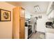 Functional kitchen with stainless steel appliances, white cabinets, and a cozy atmosphere at 1165 S Fairplay Cir # B, Aurora, CO 80012