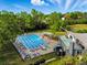 Aerial view showcasing the community pool, clubhouse, and surrounding green spaces for recreation and relaxation at 3570 E Arapahoe Pl, Centennial, CO 80122