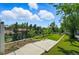 Expansive backyard with manicured lawn, mature trees, and clear sky providing a serene outdoor space at 3570 E Arapahoe Pl, Centennial, CO 80122