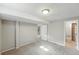 Finished basement featuring carpet and access to a bathroom at 3570 E Arapahoe Pl, Centennial, CO 80122