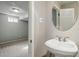 Powder room featuring small sink and a view of a finished basement at 3570 E Arapahoe Pl, Centennial, CO 80122