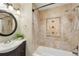 Well-lit bathroom features tiled shower, bathtub, and sink with vanity at 3570 E Arapahoe Pl, Centennial, CO 80122