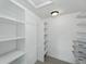 Organized walk-in closet with custom shelving for optimal storage at 3570 E Arapahoe Pl, Centennial, CO 80122
