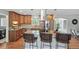 Beautiful kitchen with an island and granite countertops, stainless steel appliances, and wooden cabinets at 3570 E Arapahoe Pl, Centennial, CO 80122