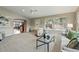Inviting living area with archway, plush seating, and view of the open floor plan at 3570 E Arapahoe Pl, Centennial, CO 80122