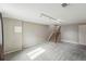 Spacious carpeted living room featuring a staircase and track lighting at 3570 E Arapahoe Pl, Centennial, CO 80122