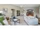 Cozy living space featuring neutral decor, arched entryway, and open floor plan at 3570 E Arapahoe Pl, Centennial, CO 80122