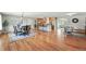 Expansive open concept living space with hardwood floors, living area, kitchen, and dining room at 3570 E Arapahoe Pl, Centennial, CO 80122