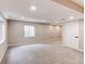 Finished basement offering a spacious area with recessed lighting, neutral walls, and carpet, perfect for flexible living at 5597 S Buchanan St, Aurora, CO 80016