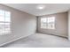 Bright bedroom with neutral walls and carpet featuring plenty of natural light from the large double-hung windows at 5597 S Buchanan St, Aurora, CO 80016