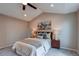 Cozy bedroom with neutral tones, plush carpeting, a vaulted ceiling and decorative pillows at 5597 S Buchanan St, Aurora, CO 80016