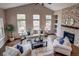 Comfortable living room with a fireplace, natural light and neutral color palette at 5597 S Buchanan St, Aurora, CO 80016