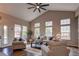 Bright living room with large windows, plush seating, and ample natural light at 5597 S Buchanan St, Aurora, CO 80016