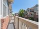 Balcony overlooking street with other brick and siding-clad houses at 701 N Roslyn St # 36, Denver, CO 80230