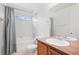 Bathroom with bathtub and shower combo, toilet, and vanity at 701 N Roslyn St # 36, Denver, CO 80230