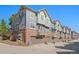 Multi-story townhomes with attached garages and balconies at 701 N Roslyn St # 36, Denver, CO 80230