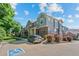Side view of attractive townhomes with well-maintained landscaping and walkways at 701 N Roslyn St # 36, Denver, CO 80230