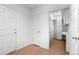 Hallway with tile flooring and white doors at 701 N Roslyn St # 36, Denver, CO 80230