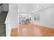 Open-concept living room featuring gleaming hardwood floors and a modern kitchen at 701 N Roslyn St # 36, Denver, CO 80230