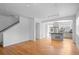 Spacious living room with hardwood floors and an open floor plan towards the kitchen at 701 N Roslyn St # 36, Denver, CO 80230