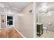 Hallway in finished basement features wood floors and doors to other rooms in the basement at 2606 W Alamo Ave, Littleton, CO 80120