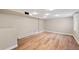 Basement room features wood floors and canned lighting at 2606 W Alamo Ave, Littleton, CO 80120