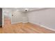 Basement room features wood floors, canned lighting, and a window at 2606 W Alamo Ave, Littleton, CO 80120