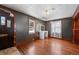 Bedroom with vintage charm including hardwood floors, vanity area, and natural light at 2606 W Alamo Ave, Littleton, CO 80120