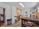 Functional kitchen area with stainless steel appliances and ample workspace with a large work table at 2606 W Alamo Ave, Littleton, CO 80120