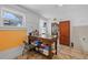 Kitchen has a large work table with storage, a window for natural light, and tile flooring at 2606 W Alamo Ave, Littleton, CO 80120