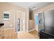 Kitchen featuring wood floors, stainless steel appliances, and multiple doorways at 2606 W Alamo Ave, Littleton, CO 80120