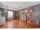 Living room featuring hardwood floors, grey paint and vintage woodwork details at 2606 W Alamo Ave, Littleton, CO 80120