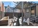 Cozy backyard area featuring string lights, comfortable seating, a garden bed, and a private fence at 288 S Sherman St, Denver, CO 80209