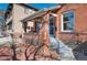 Attractive brick home exterior with inviting front steps and a well-maintained front yard at 288 S Sherman St, Denver, CO 80209