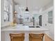 Bright kitchen featuring white cabinetry, quartz countertops, and modern fixtures at 288 S Sherman St, Denver, CO 80209