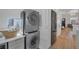 Convenient laundry area with modern washer and dryer set and ample storage space and black refrigerator at 288 S Sherman St, Denver, CO 80209