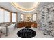 Elegant bathroom with soaking tub, double vanities, and marble finishes at 9977 Elkhorn St, Littleton, CO 80127