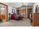 Cozy bedroom with built-in shelving, a comfortable bed, and natural light at 9977 Elkhorn St, Littleton, CO 80127