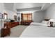 Spacious bedroom with two queen beds, a desk, and ample closet space at 9977 Elkhorn St, Littleton, CO 80127