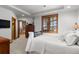 Bright bedroom featuring a king-size bed and en-suite bathroom access at 9977 Elkhorn St, Littleton, CO 80127