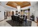 Elegant dining room with a beautiful chandelier and seating for six at 9977 Elkhorn St, Littleton, CO 80127