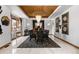 Formal dining room features a stunning chandelier and hardwood floors at 9977 Elkhorn St, Littleton, CO 80127