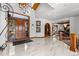 Grand entryway with high ceilings, marble floors, and a water feature at 9977 Elkhorn St, Littleton, CO 80127