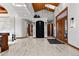 Elegant entryway with high ceilings, marble floors, and a water feature at 9977 Elkhorn St, Littleton, CO 80127